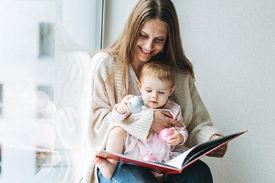 Mom and baby reading together