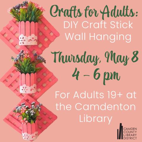 Cute wall hanging made from jumbo craft sticks on a pink background